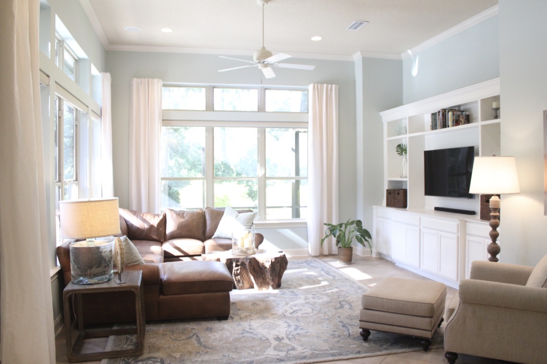 A coastal style home in St. Johns, Florida with ample lighting and a room decorated with coastal elements.
