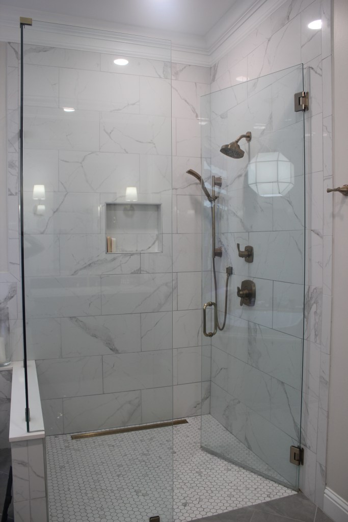 marble look porcelain tile in a seamless shower