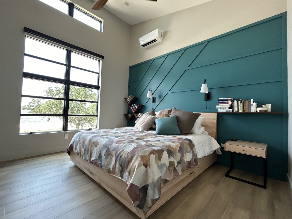 accent wall in master bedroom with architectural detailing