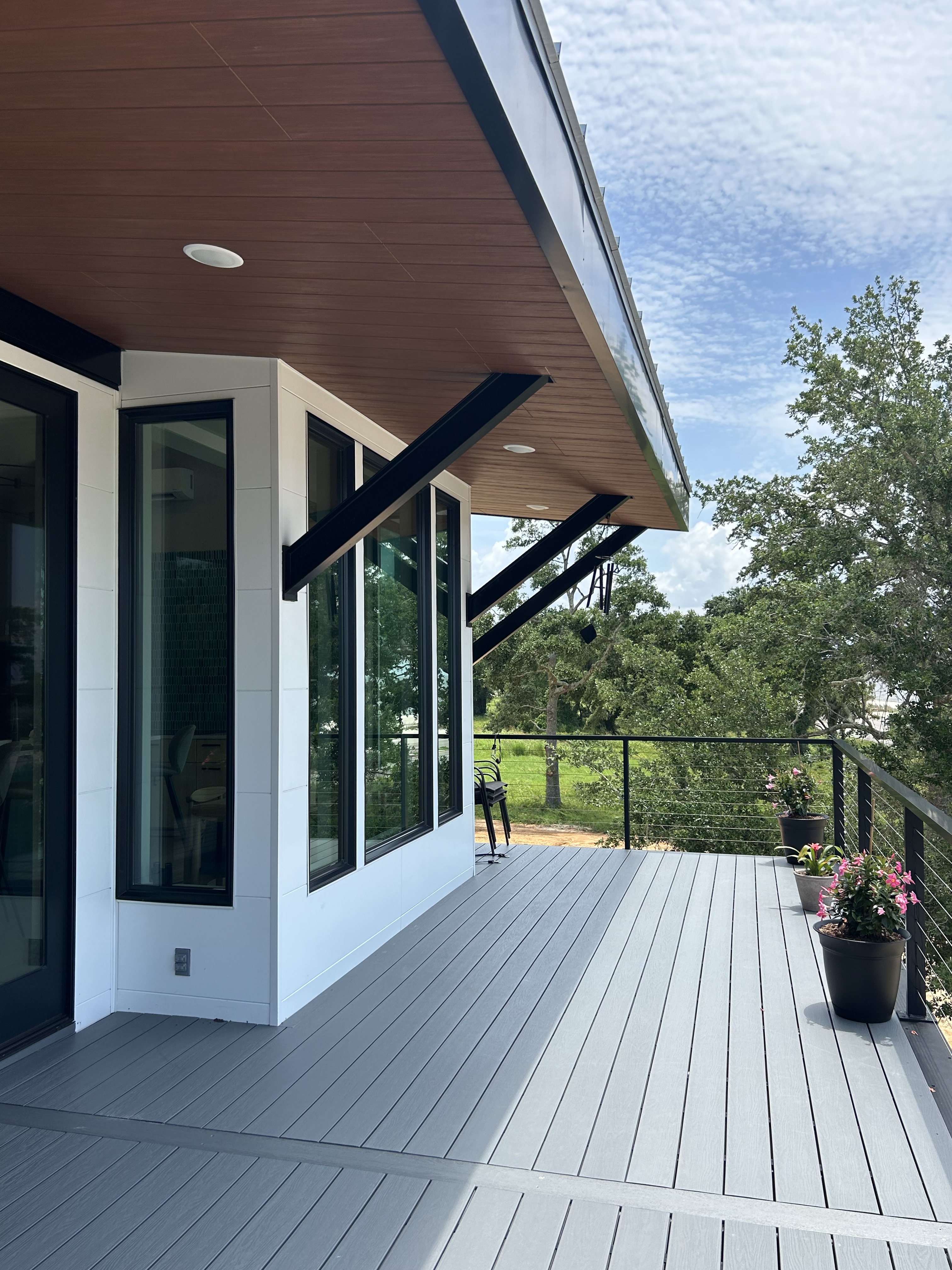 Exterior view of coastal home on pillars